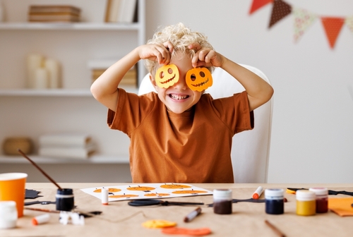 Portrait,Of,Cute,Kid,Boy,Making,Halloween,Home,Decorations,While