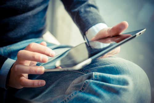 Close,Up,Hands,Multitasking,Man,Using,Tablet,,Laptop,And,Cellphone