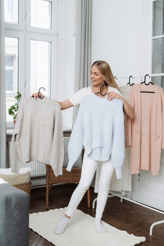 Concepts,Choice,Of,Clothes.,Vertical,Shot,Of,Happy,Woman,Standing