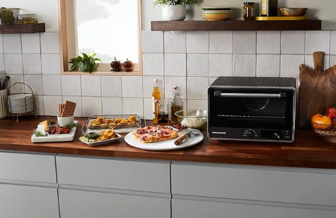 Aprovecha la oferta única: el Horno Tostador y Freidora KitchenAid con un descuento del 36%. Este elegante electrodoméstico no solo agrega estilo a tu cocina, sino que también leuda, deshidrata, tuesta y fríe al aire. ¡Potencia y versatilidad en un solo aparato!
